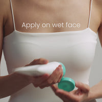 Person in a white top holding a white tube with a teal cap, text above reads "Apply on wet face."